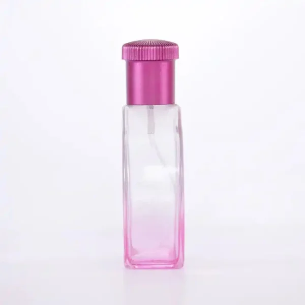 Flacone di profumo rotondo rosa da 100 ml con tappo a baionetta in acrilico e spruzzatore in alluminio dorato - immagine 3